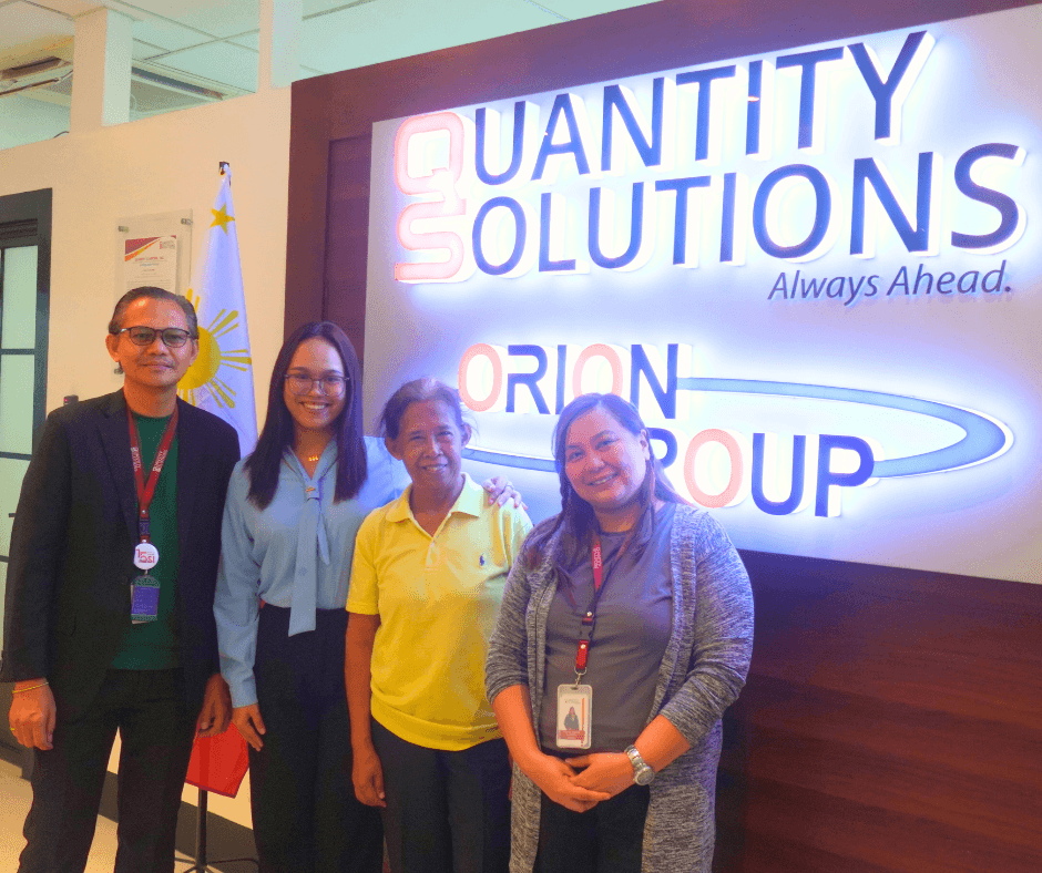 QSI team members Nikku Esplanada (Senior Director, HR and Admin) and Pamela Cortes (Sr. Marketing Manager) celebrate with Ariann and her grandmother Mrs. Terry Licayan at the QSI office.